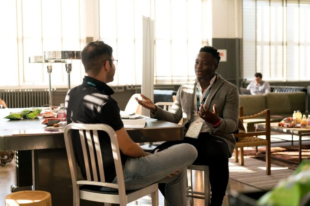 Level 1 Award in Mentoring: two adults discussing goals in a mentoring conversation